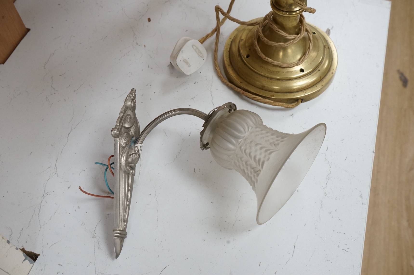 A brass table lamp and a chrome Art Deco style wall light, both with glass shades, lamp 58cm high